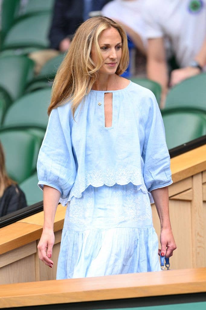 Harriet Sperling in royal box in blue top and skirt