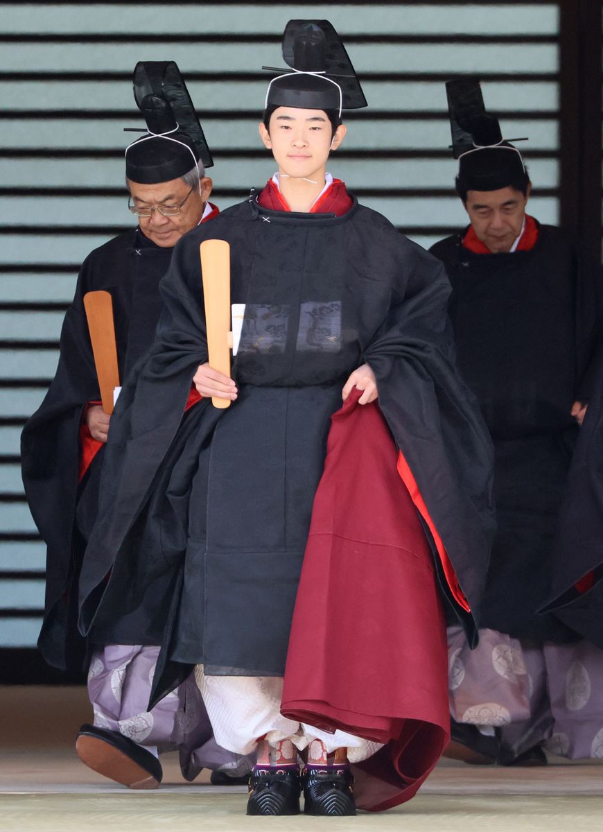 Japanese Prince Hisahito, son of Crown Prince Akishino, wearing an ancient ceremonial costume, leaves for a ceremony by a carriage at the Imperial Palace in Tokyo on September 6, 2025.