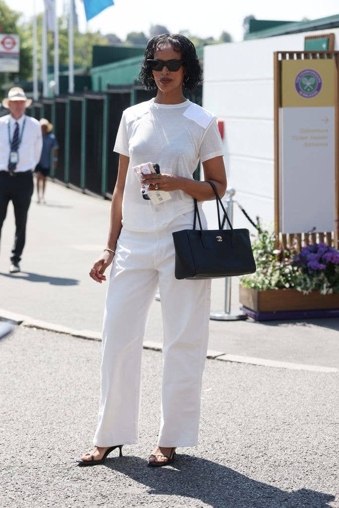 A photo of Sabrina Elba wearing an all-white outfit