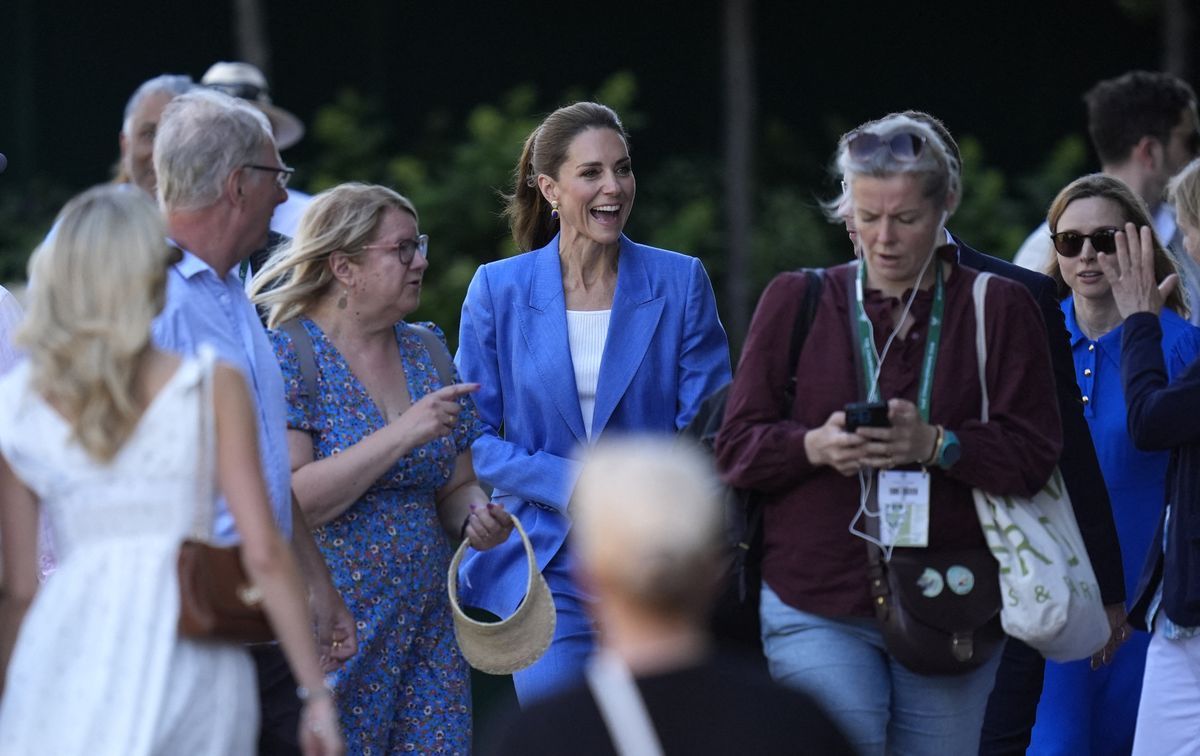 Before the first serve, Princess Kate took time to pose for photos and greet tennis fans gathered at Wimbledon.