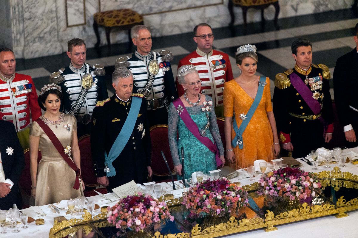 The royal Danish and royal Belgian family stands during the national anthem at the State Dinner at Christiansborg on March 28, 2017 in Copenhagen