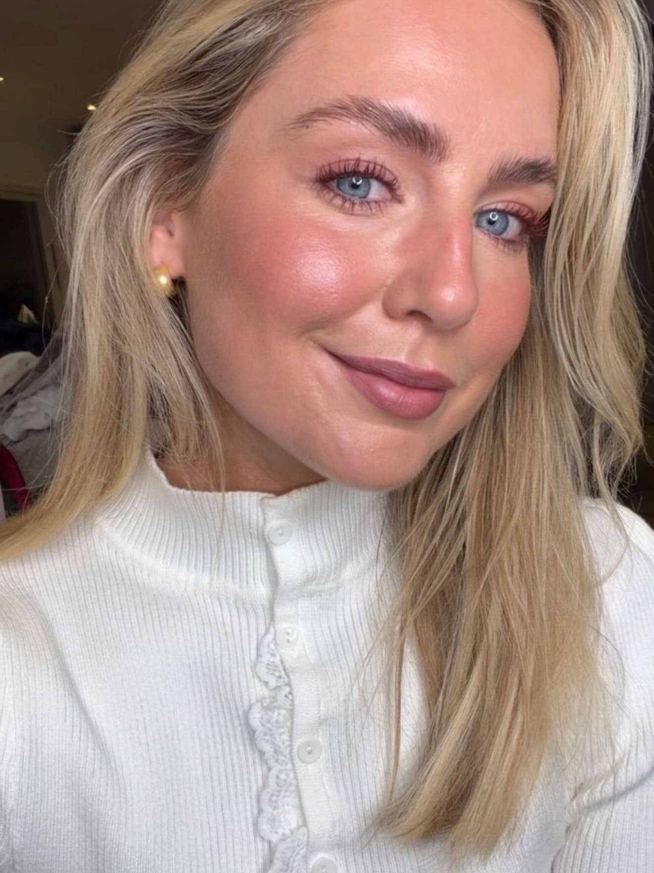blonde woman taking a selfie