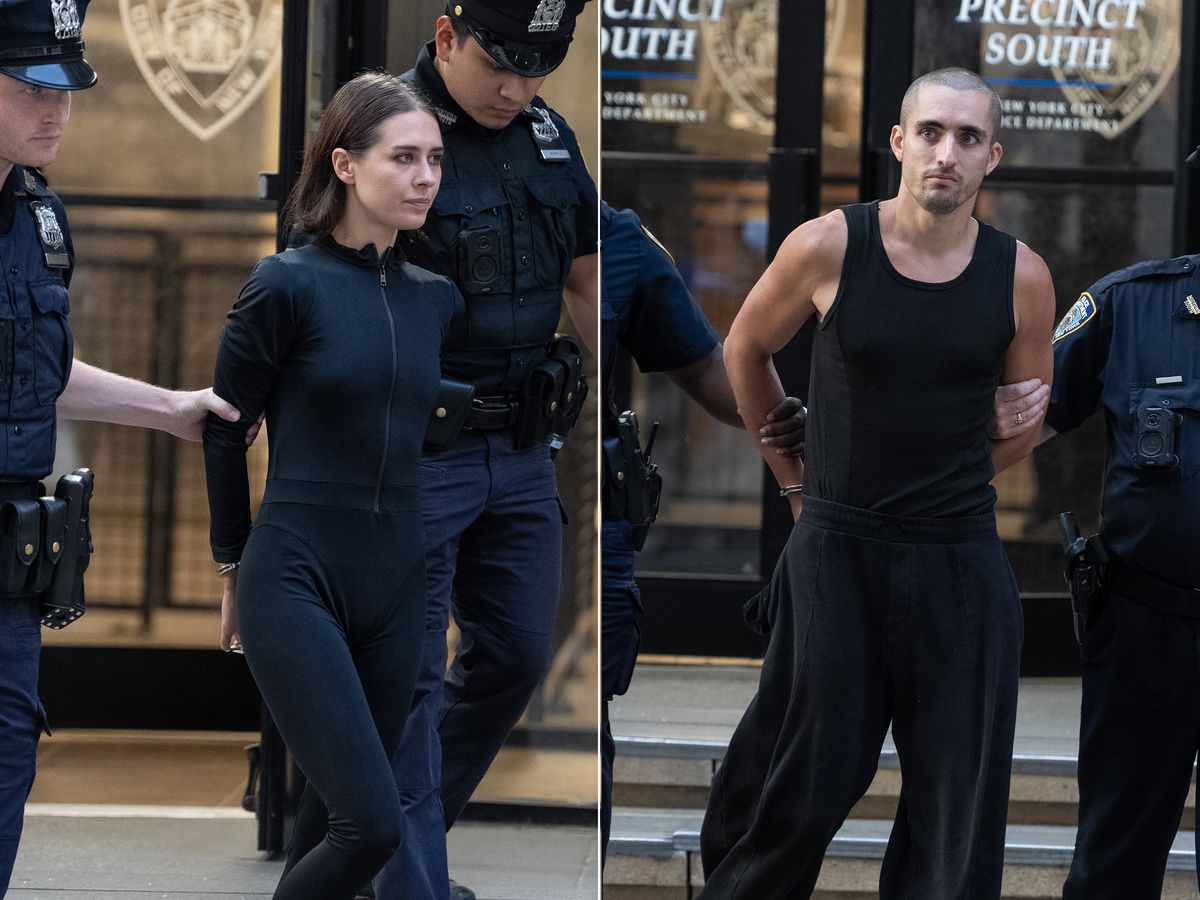 Angela Nikolau, left, and Ivan Beerkus are pictured in police custody leaving the New York Police Department's Midtown South Precinct station house