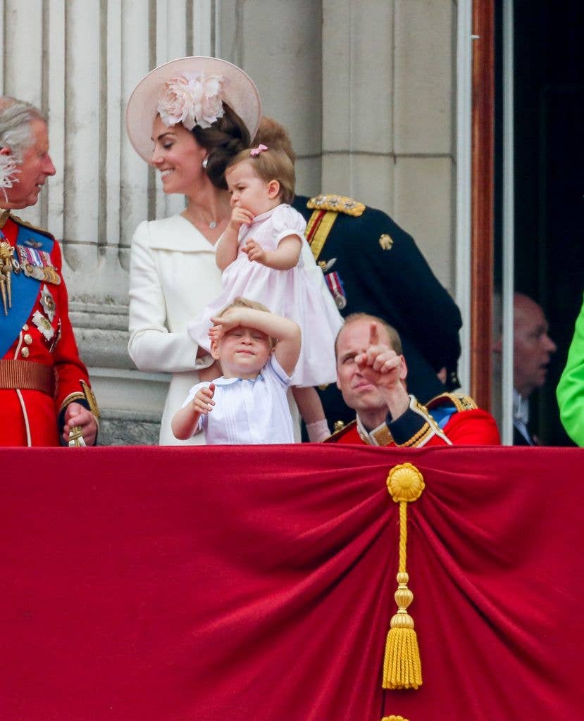 Prince William bending down to talk to Prince George at Trooping the Colour 2016