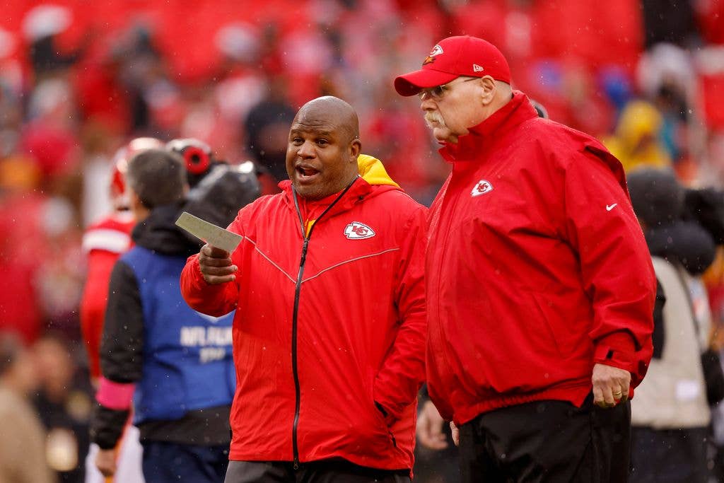Offensive Coordinator Eric Bieniemy talks with head coach Andy Reid of the Kansas City Chiefs prior to the AFC Divisional Playoff game against the Jacksonville Jaguars at Arrowhead Stadium on January 21, 2023 in Kansas City, Missouri