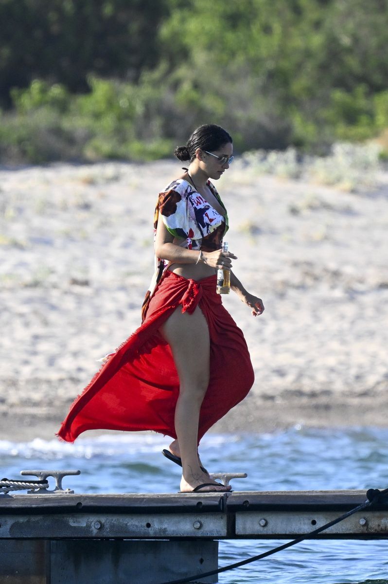 Tatiana Gabriela embraced effortless summer fashion in a colorful printed cropped top layered over a green bikini