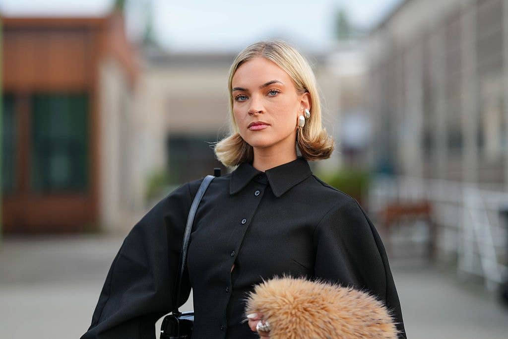 woman at fashion week with a short blonde bob 