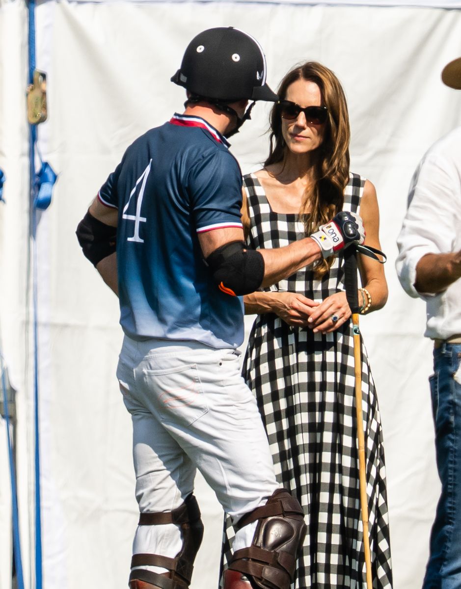 The Prince and Princess of Wales enjoy a lighthearted moment during the Royal Charity Polo Cup.