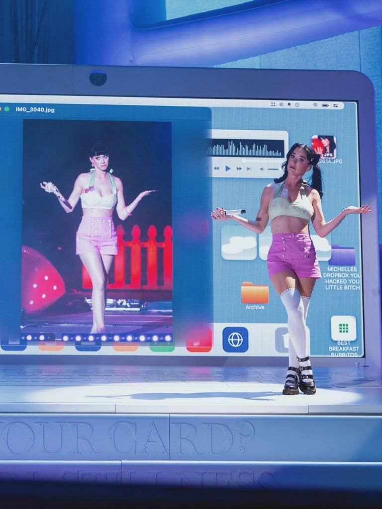 Katy Perry poses side-by-side with a throwback photo of herself performing at the Under 18 Festival while in concert in Madrid, Spain on July 5, 2026