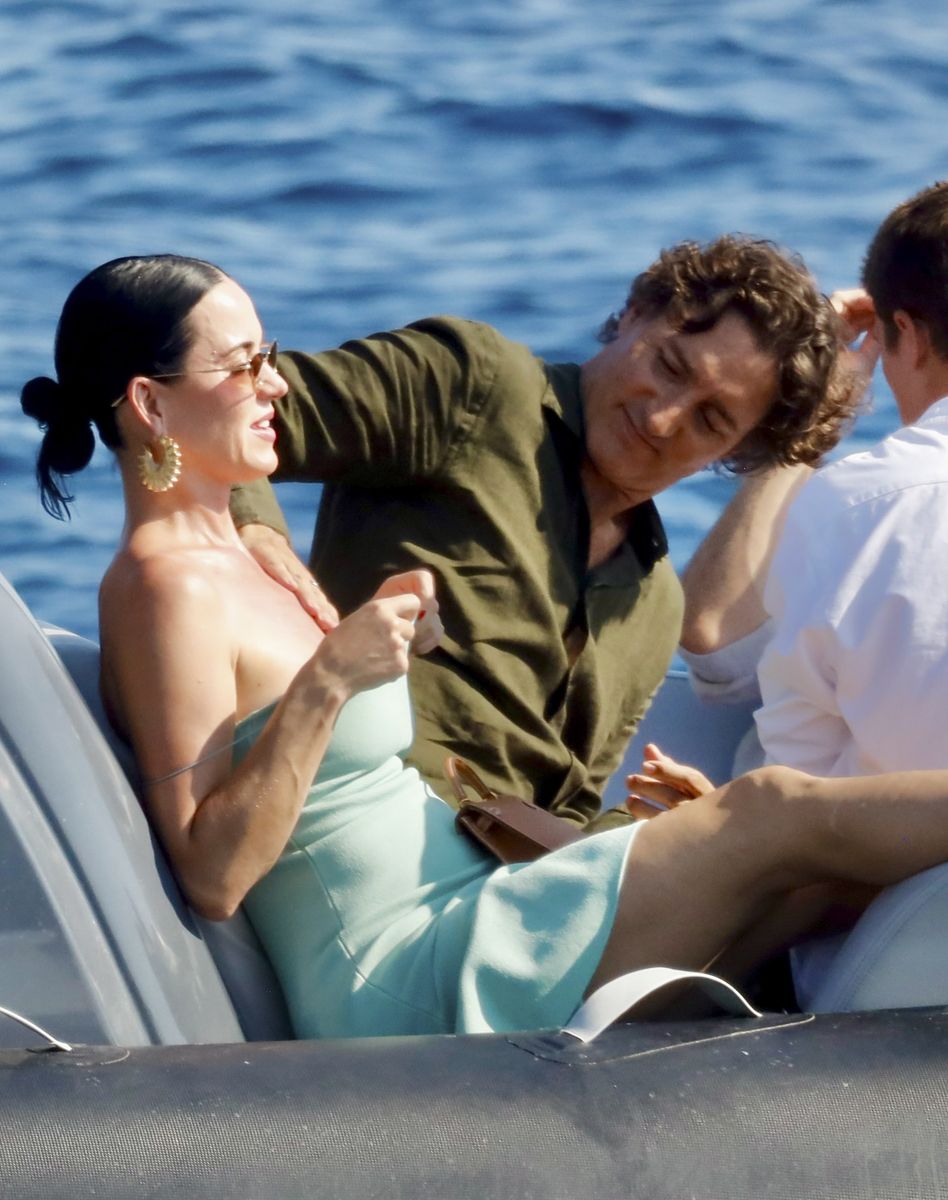 Justin had a smile on a face as he applied sunscreen