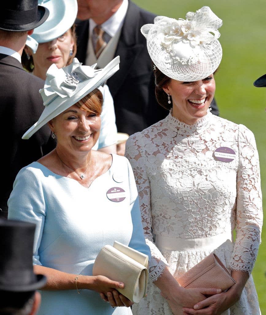 Catherine, Duchess of Cambridge (R) and her mother Carole Middleton  smiling together