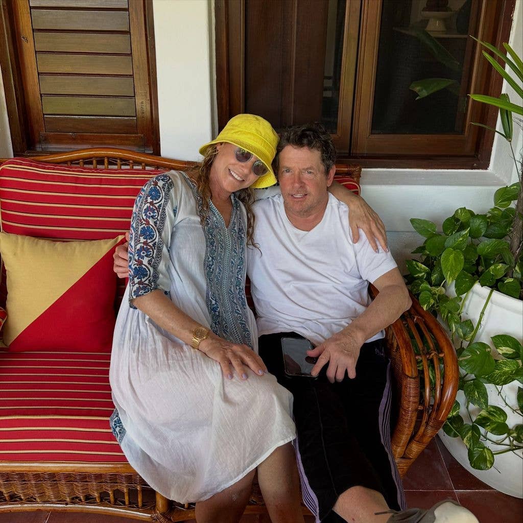 Michael J. Fox and Tracy Pollan pose for a photo on a bench outside their Hamptons home, shared on Instagram