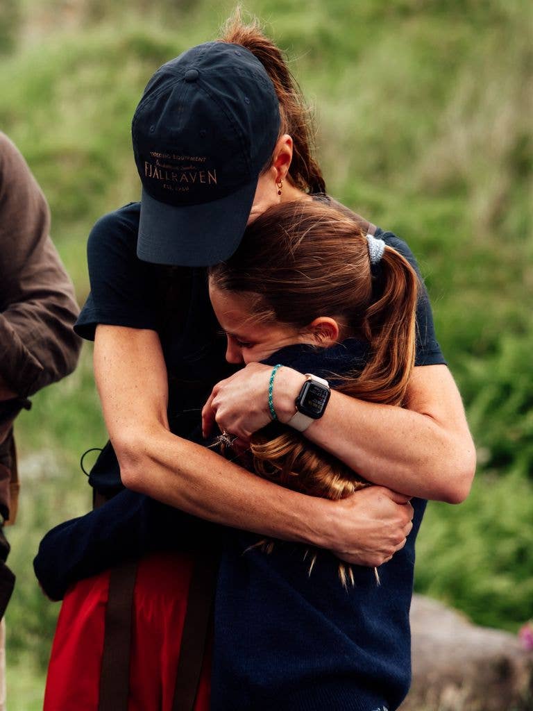 Kate Middleton hugs her daughter Princess Charlotte after completing the National Three Peaks Challenge