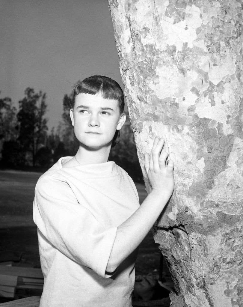 Sheila James Kuehl poses next to a tree.