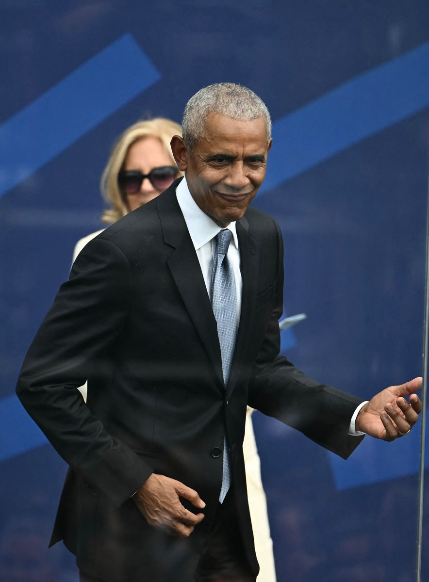 Former US president Barack Obama plays air guitar during the opening of the Barack Obama Presidential Center in Chicago