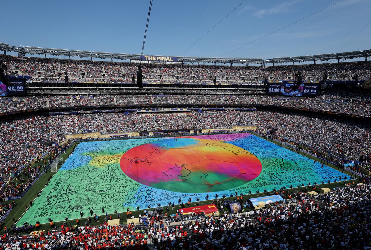 A field covering designed by Misty Buckley features hand-drawn jerseys representing all 211 FIFA member associations.