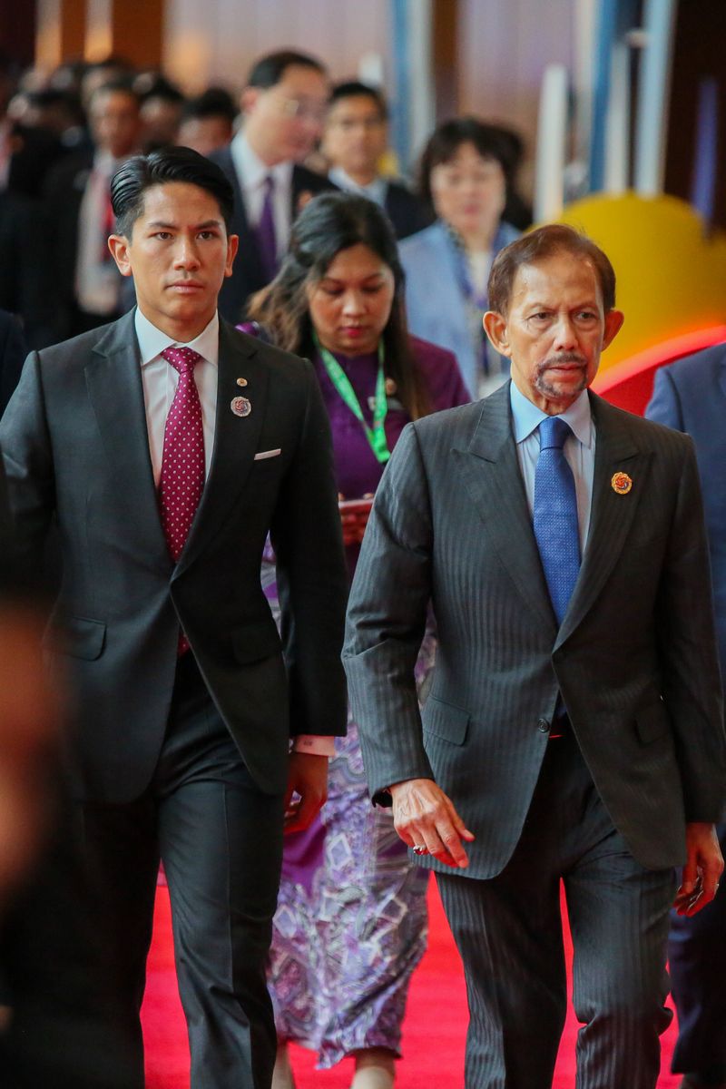 The Sultan with one of his most admired sons, Prince Abdul Mateen, at an international summit in Kuala Lumpur, the capital of Malaysia