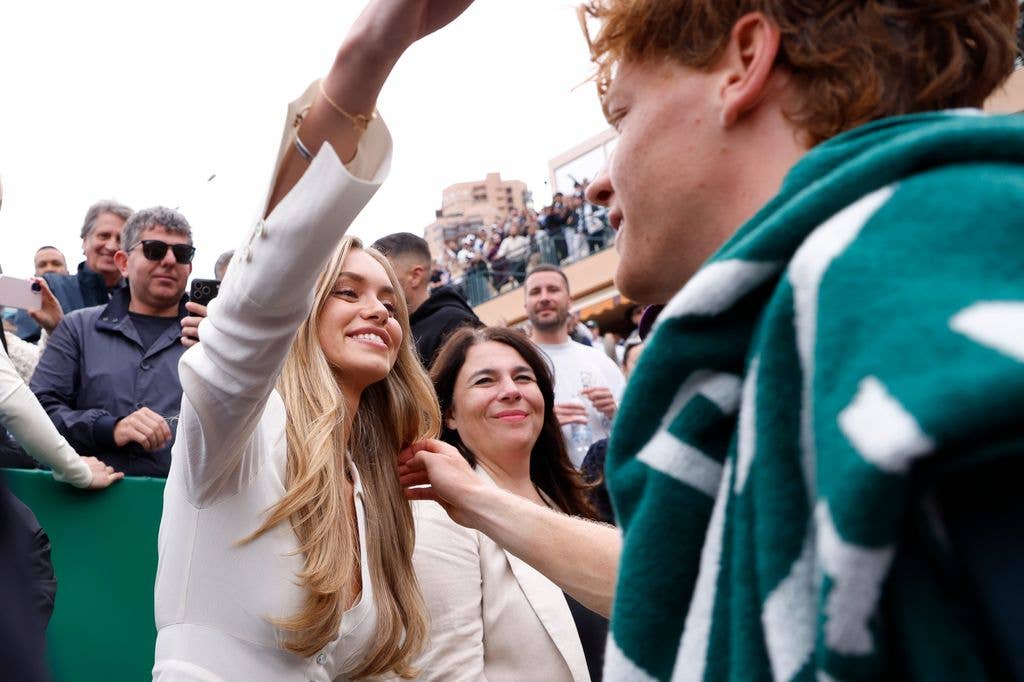 Jannik Sinner going in for a hug with girlfriend Laila Hasanovic