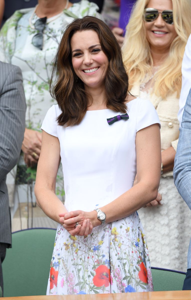 Kate Middleton captivates in a bold red Roland Mouret dress for her triumphant Wimbledon women's final appearance.