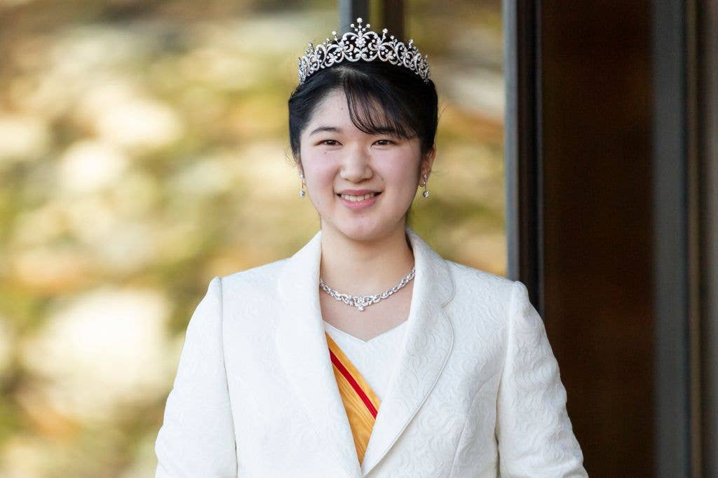 Princess Aiko in a white coat, outfit and tiara