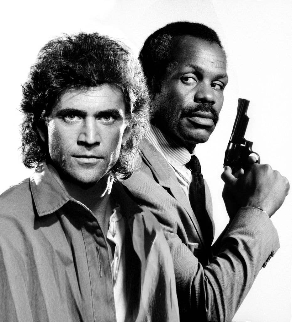 Mel Gibson and Danny Glover pose for the Lethal Weapon " movie poster in Los Angeles, California