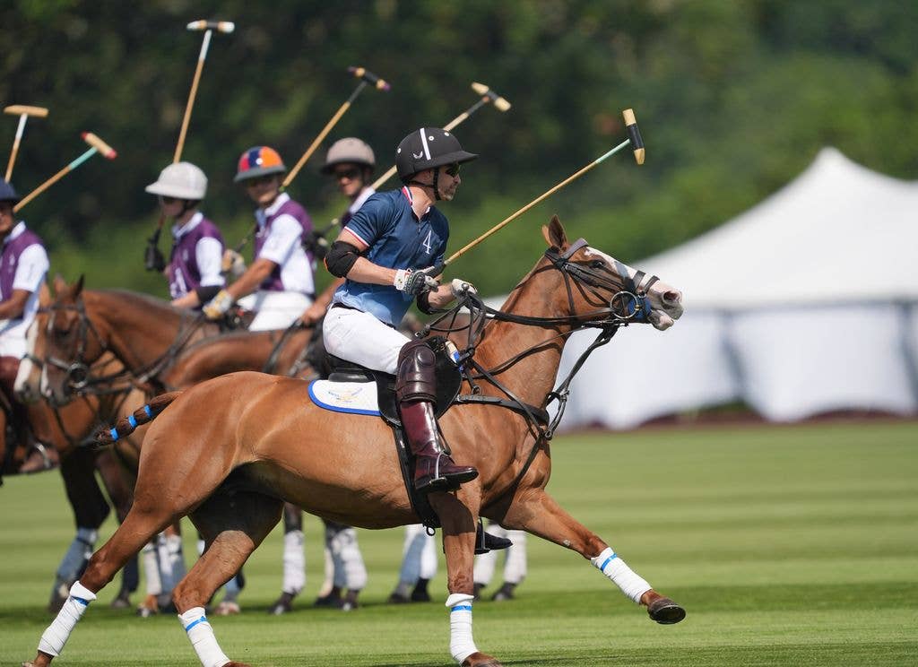 The Prince of Wales takes part in the DMMI Royal Charity Polo Cup 2026 at Guards Polo Club in Windsor Great Park, Berkshire