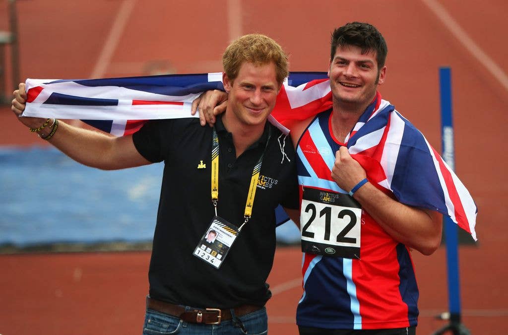 David celebrating with Harry after winning gold in the 200m Men Ambulant IT2 final at the Games in 2014