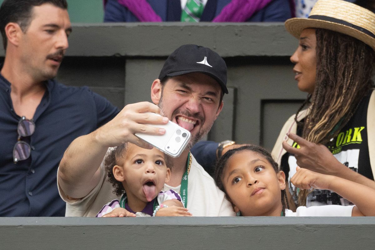 Alexis Ohanian, husband of Serena Williams of the United States, takes a selfie with their children Olympia Ohanian Jr. and Adira River Ohanian, in the team box before her match against Maya Joint of Australia.