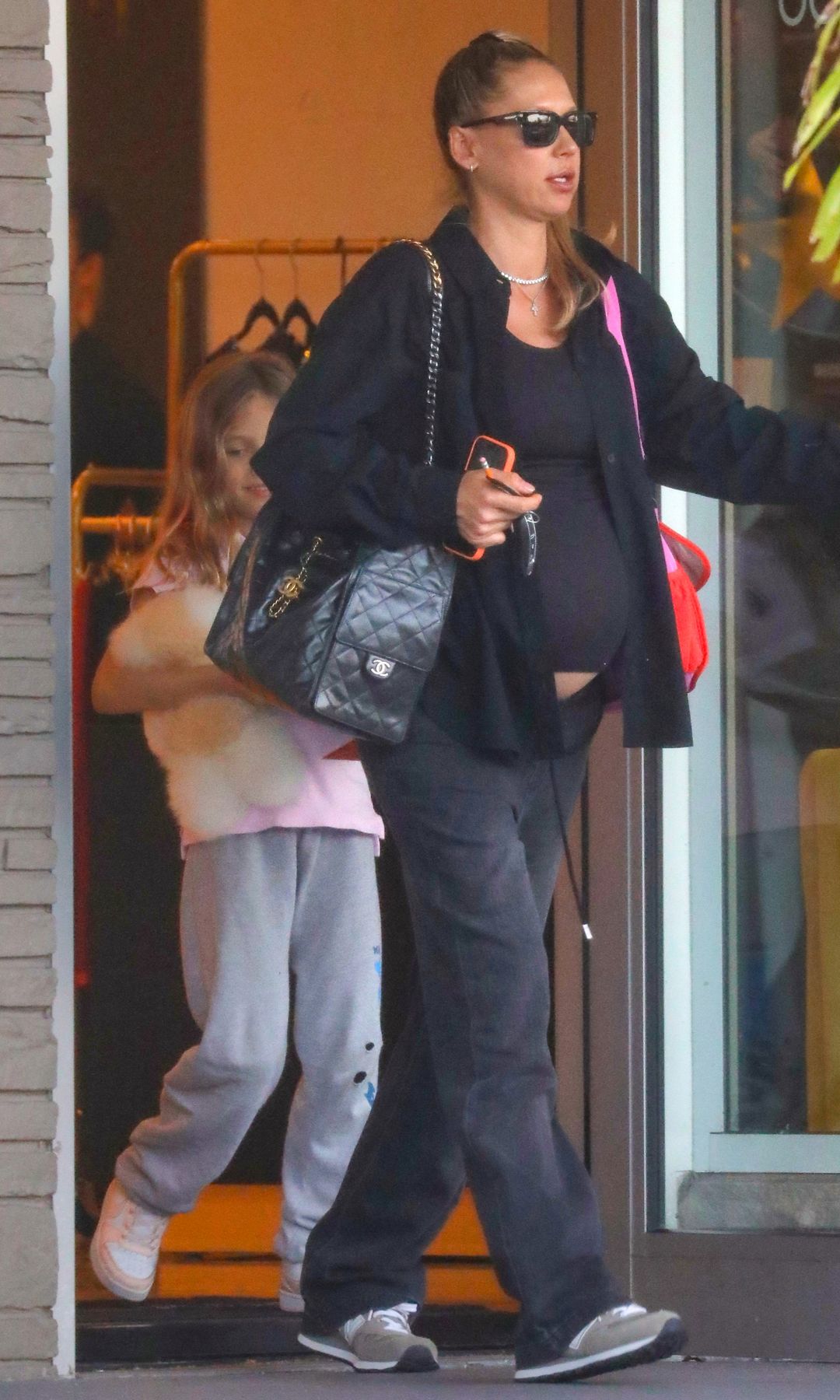 Kournikova wore a tight black t-shirt that showed off her pregnancy