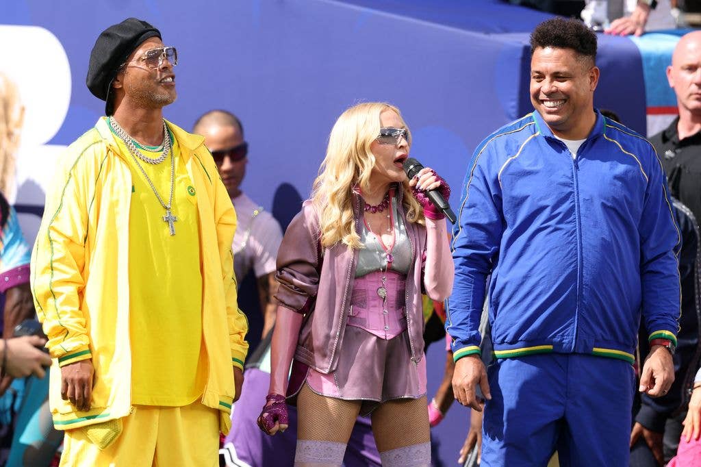 Madonna performing during the Halftime Show, flanked by Ronaldinho and Ronaldo