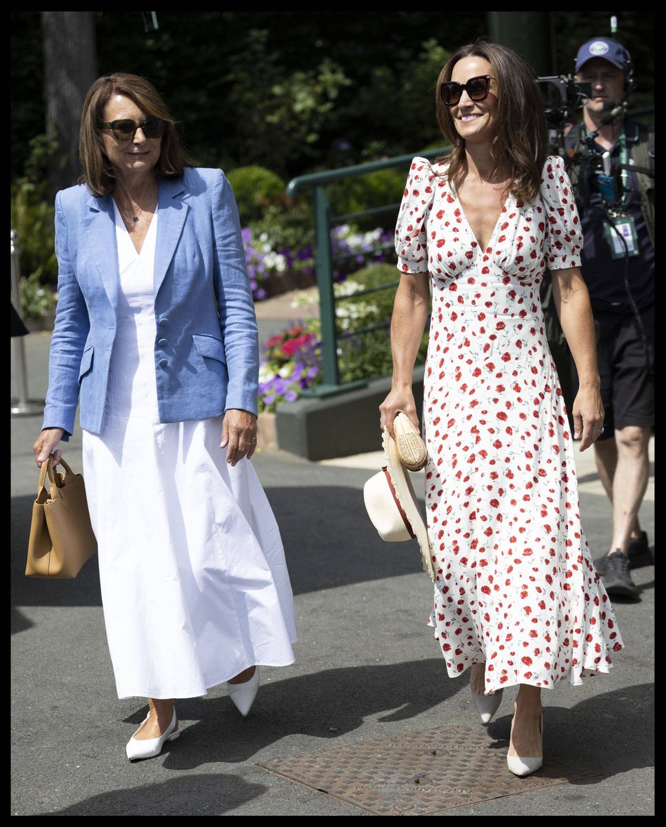 Carole Middleton complemented her daughter's look in a white midi dress and pastel blue blazer while watching the action from Centre Court.