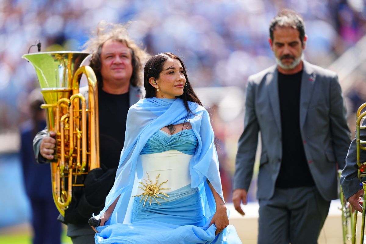 The singer honored her homeland in a custom sky-blue and white gown inspired by the Argentine flag.