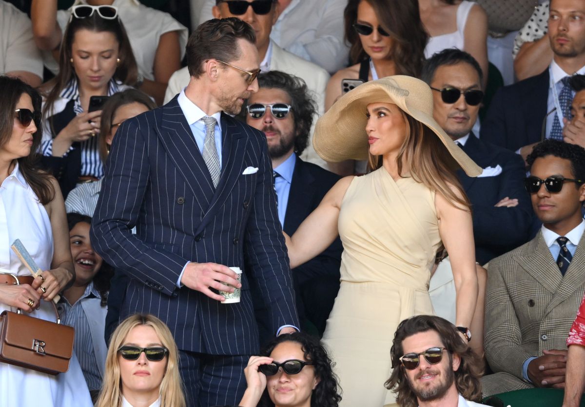 Tom Hiddleston and Jennifer Lopez, wearing Ralph Lauren,  attend day fourteen of the 2026 Wimbledon Tennis Championships