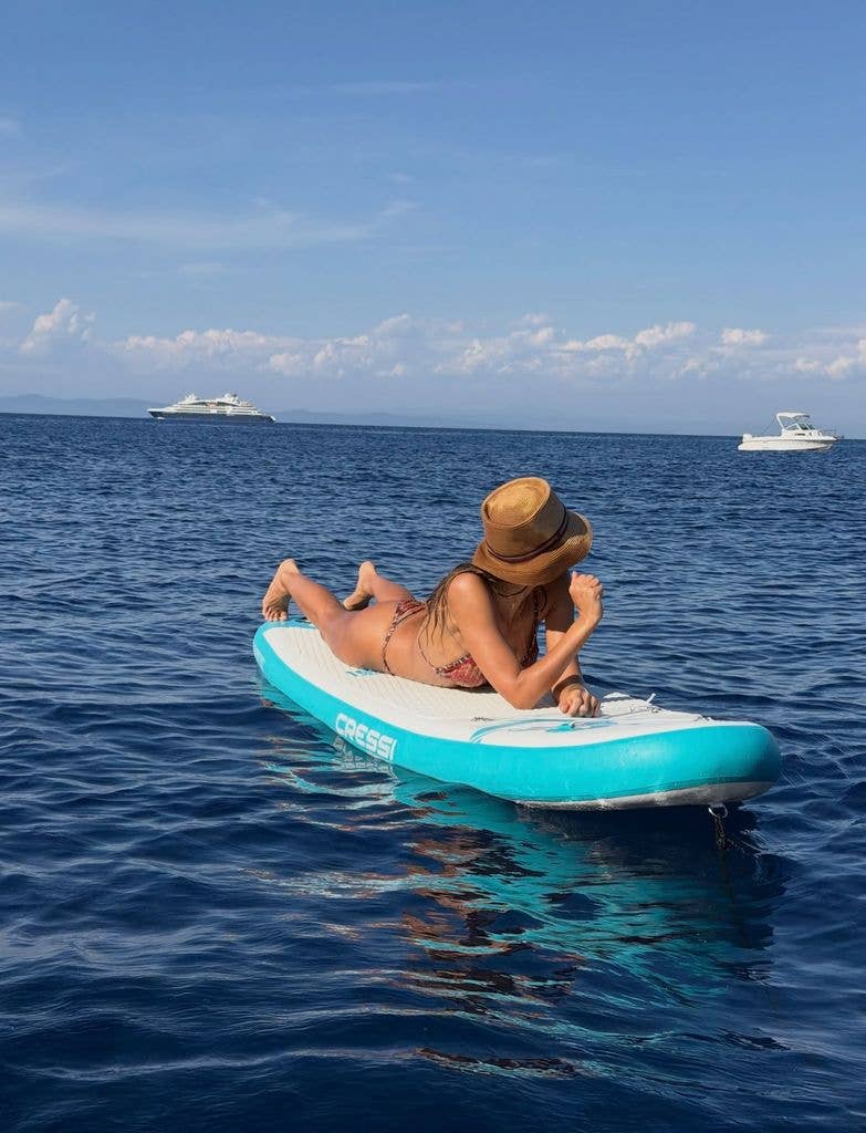 Jessica Alba on surfboard in sea