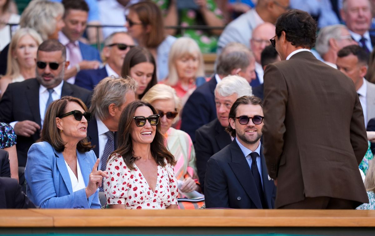 Carole Middleton and Pippa Matthews speaking with Roger Federer in the royal box on day eight of the 2026 Wimbledon Championships