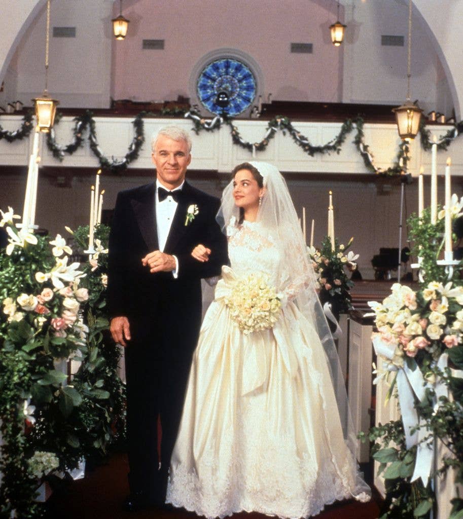 Steve Martin walking down the aisle with Kimberly Williams-Paisley in a scene from the film 'Father Of The Bride'