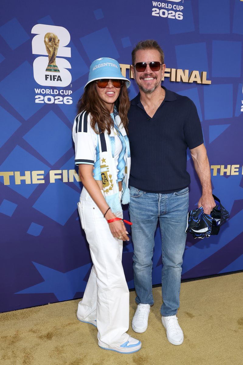 Luciana paired her Argentina top with white jeans, a blue bucket hat, sunglasses, and sneakers.