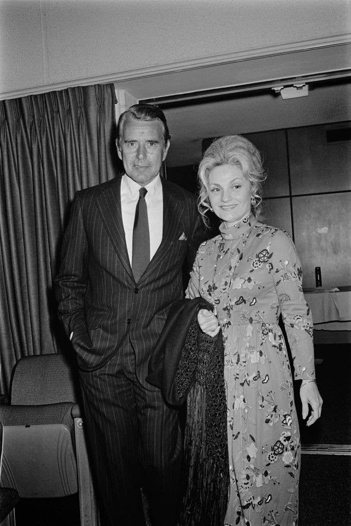 American actor John Forsythe (1918 - 2010) and his wife Julie attend a screening of the film 'Plaza Suite' at the Directors' Guild Theater in New York City, 5th June 1971. 