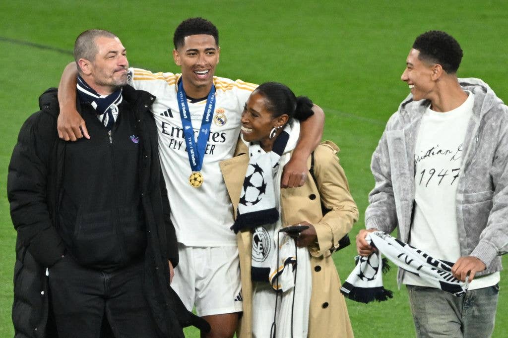Real Madrid's English midfielder #05 Jude Bellingham celebrates with his mother Denise, his father Mark and his brother Jobe after the UEFA Champions League final football match between Borussia Dortmund and Real Madrid, at Wembley stadium, in London, on June 1, 2024. (Photo by JUSTIN TALLIS / AFP via Getty Images)