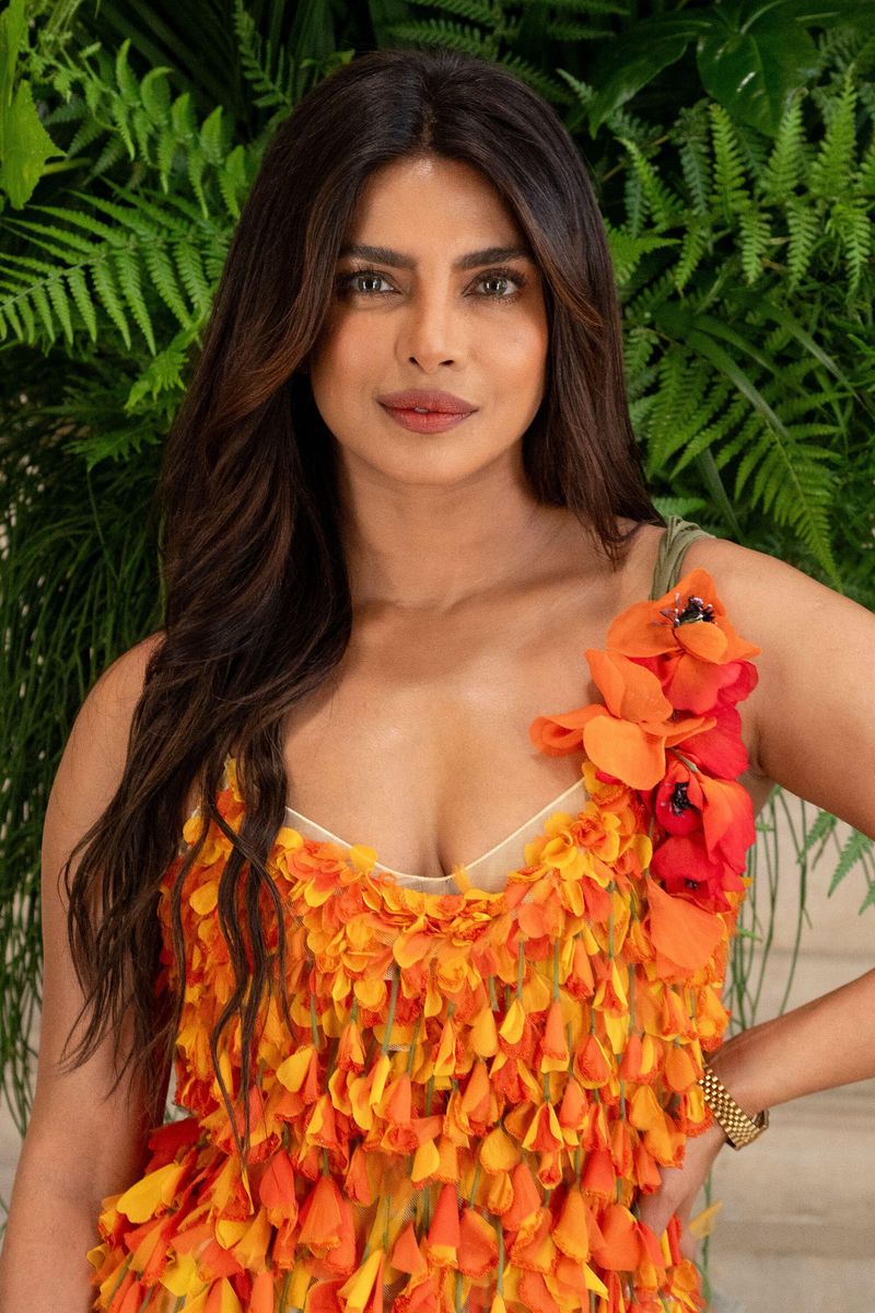 Priyanka Chopra Jonas embraced bold summer glamour in a vibrant floral midi dress during the Dior Haute Couture show in Paris.