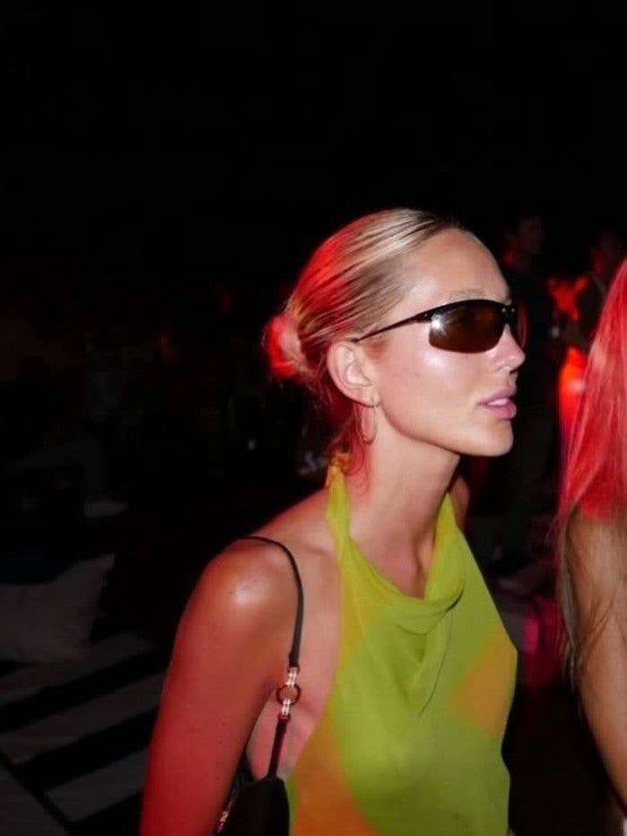 Princess Olympia of Greece and Denmark in a green and yellow top at a night event.