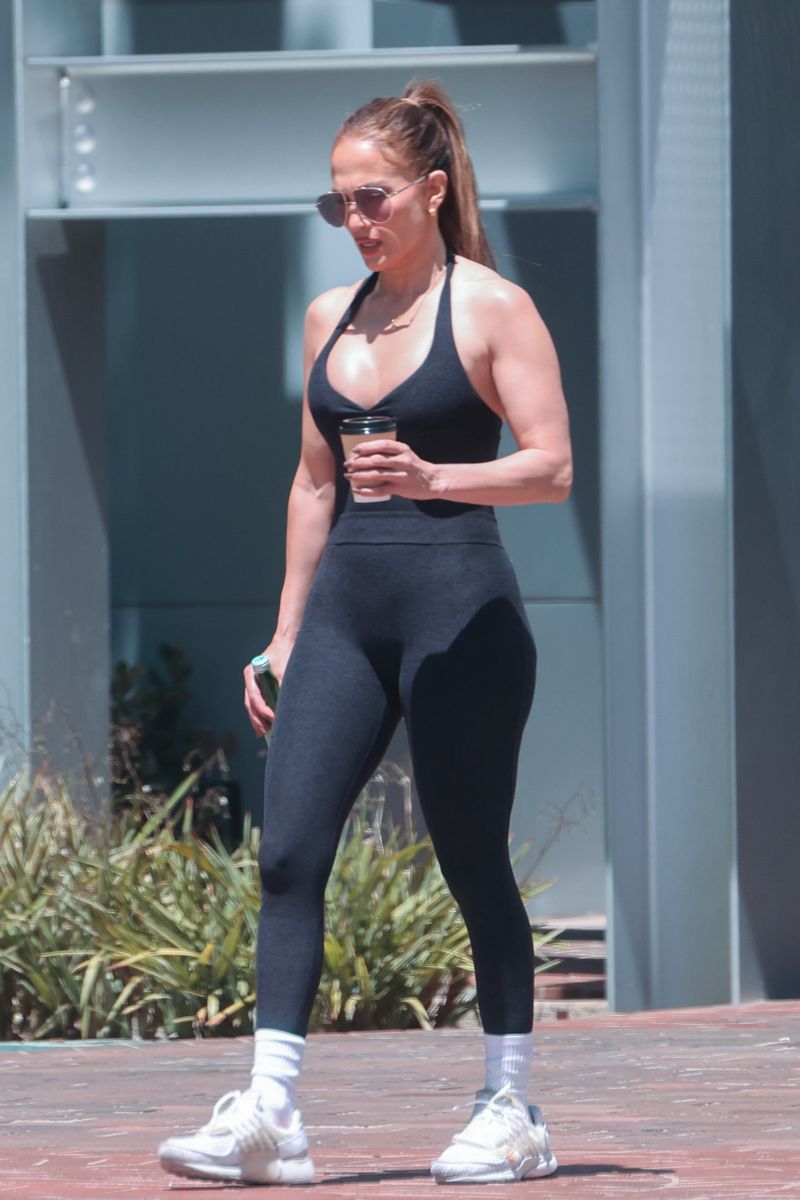 Jennifer Lopez kept things sporty and stylish in a halter-neck jumpsuit that highlighted her sculpted physique.