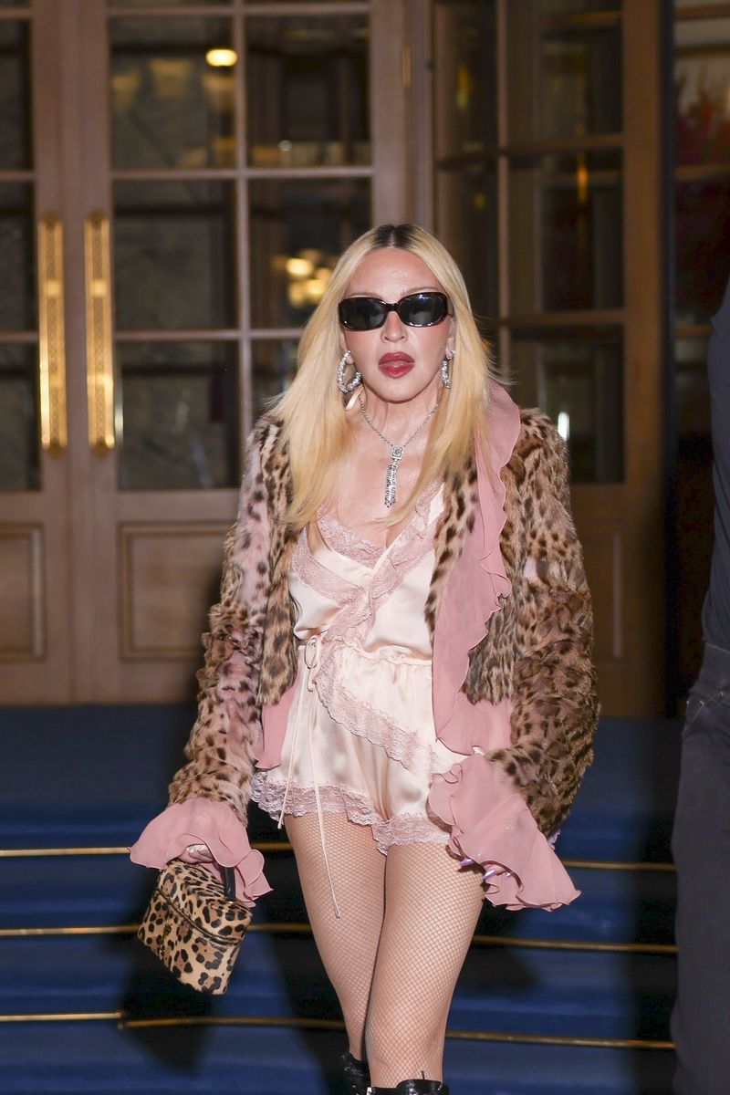 Madonna showcased her signature fearless style with vintage-inspired lace details, sparkling jewelry, and sleek platinum-blonde hair.