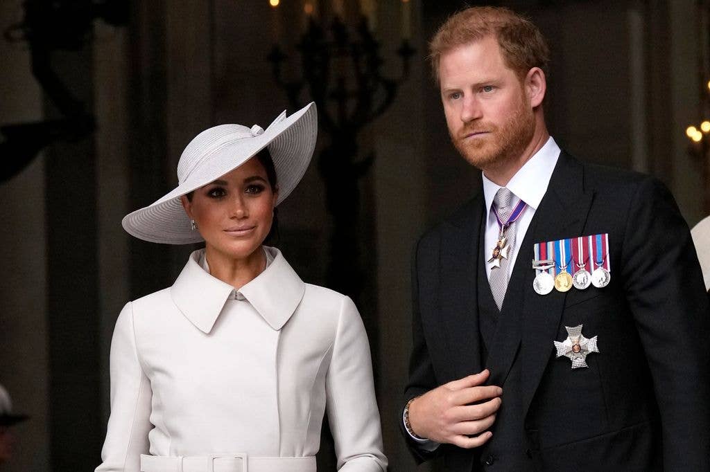 Prince Harry and Meghan Markle, Duke and Duchess of Sussex leave after a service of thanksgiving for the reign of Queen Elizabeth II at St Paul's Cathedral in London, Friday, June 3, 2022