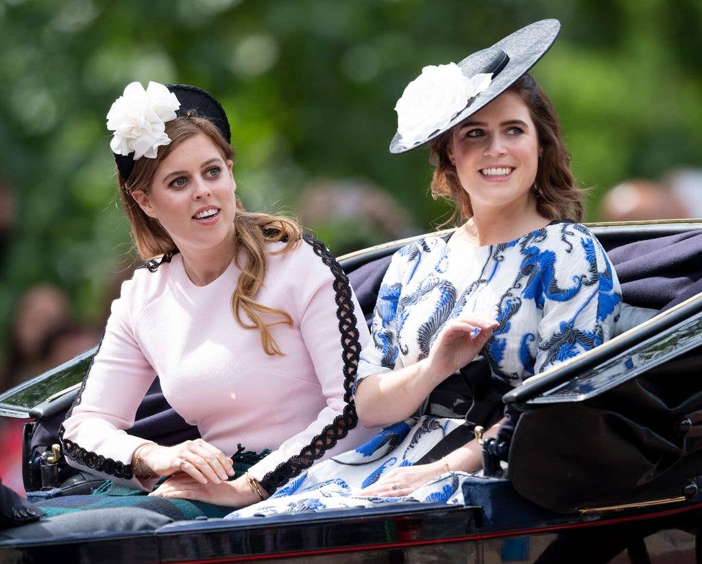 Pricess Beatrice and Princess Eugenie riding in a carriage