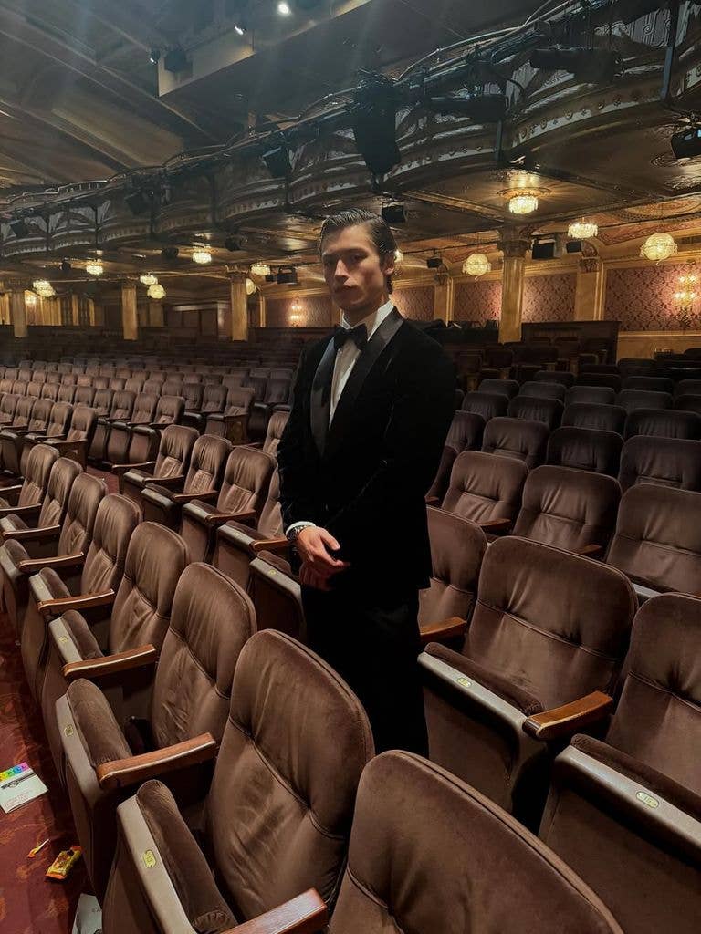 Joaquin posing in tuxedo