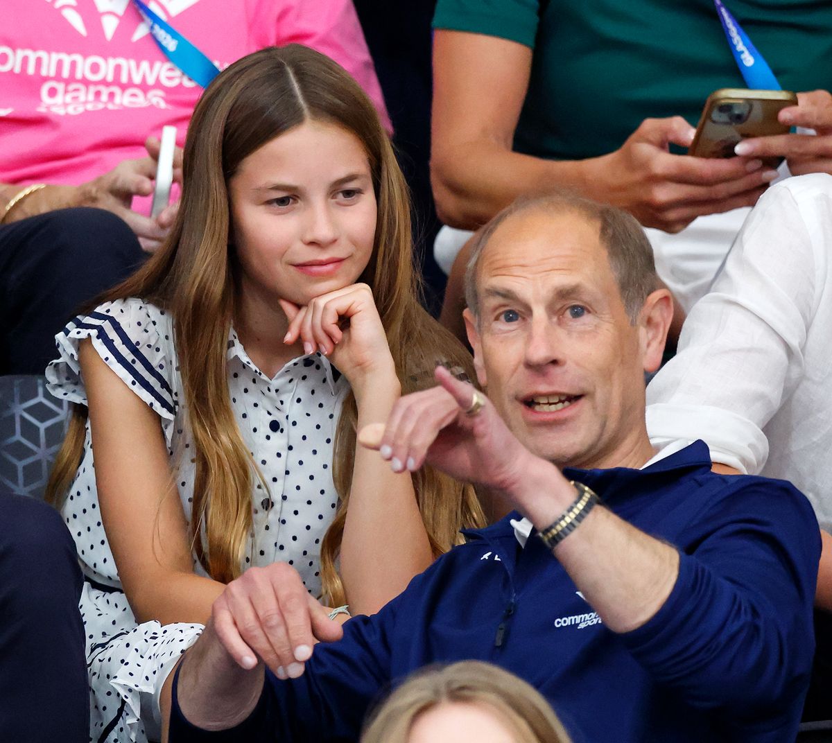 Princess Charlotte shares a sweet moment with her great-uncle Prince Edward while watching track cycling at the Commonwealth Games in Glasgow.