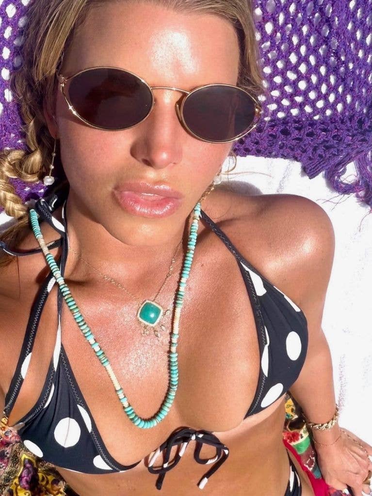 Jessica Simpson poses for a selfie wearing a polka dot bikini on July 10, 2026, shared on Instagram