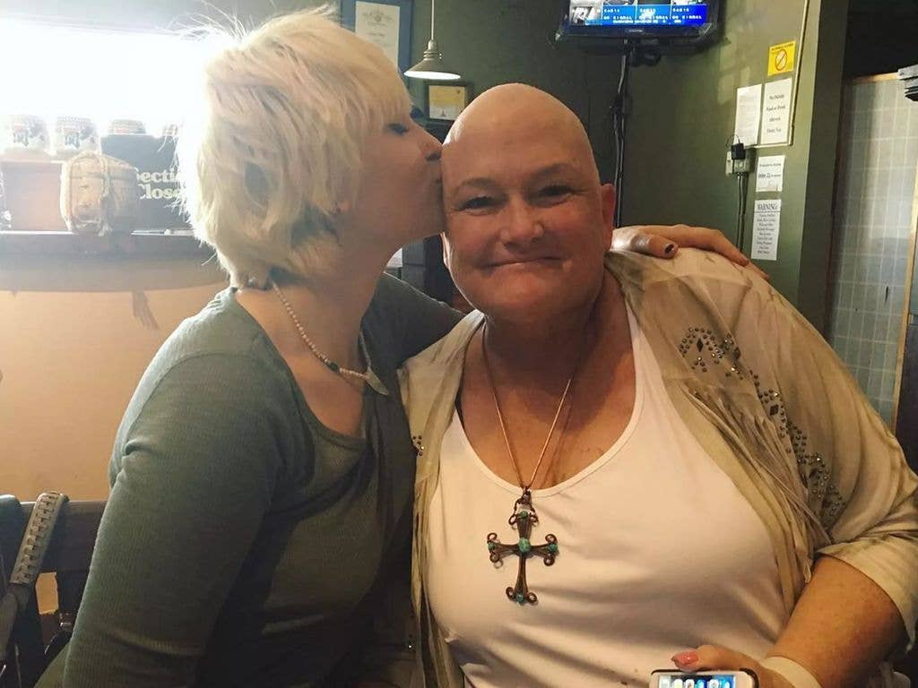 photo of paris jackson kissing debbie rowe bald head