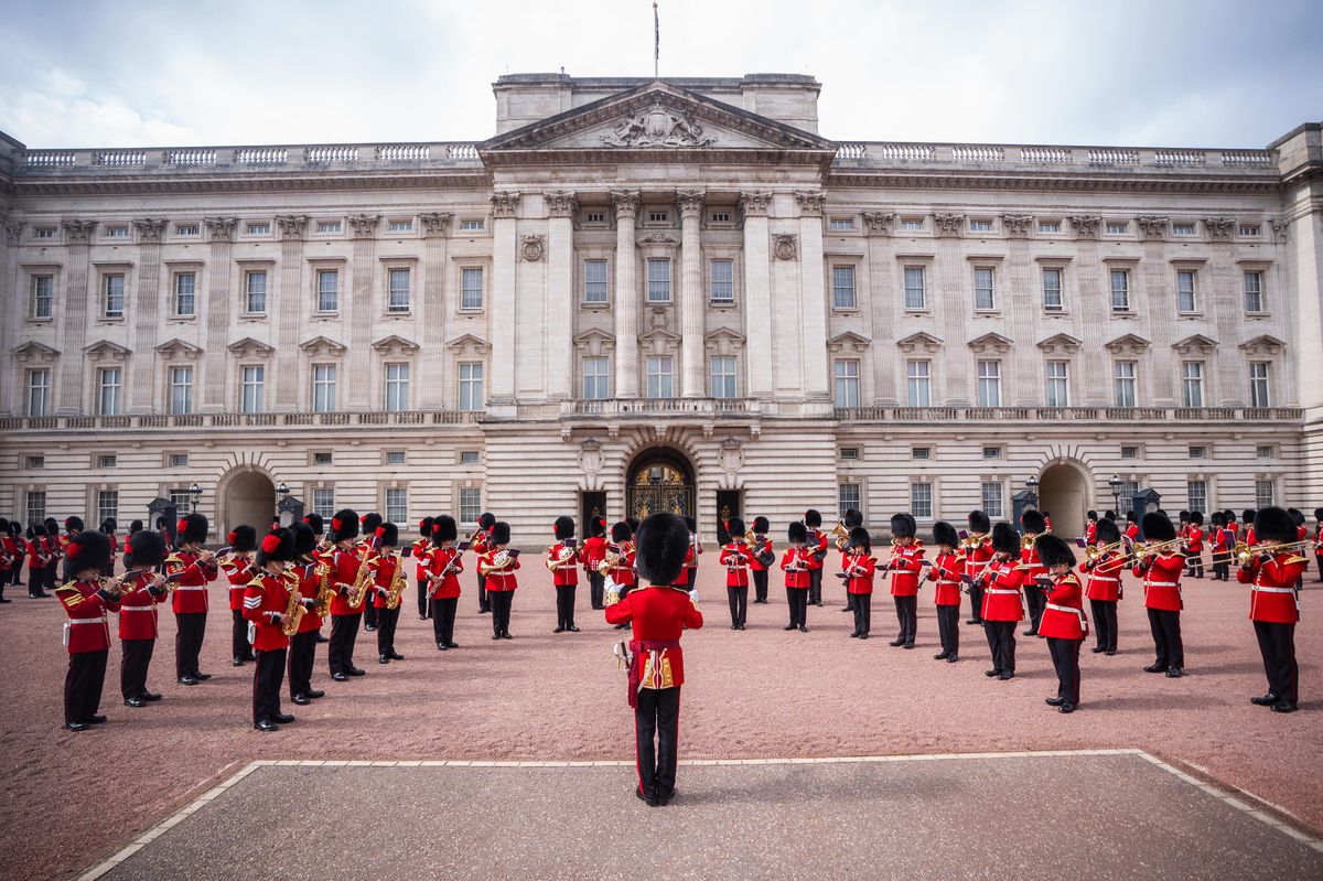 Members of the band of the Coldstream Guards and Welsh Guards play a tribute to singer Dolly Parton during the Changing the Guard at Buckingham Palace, London.
